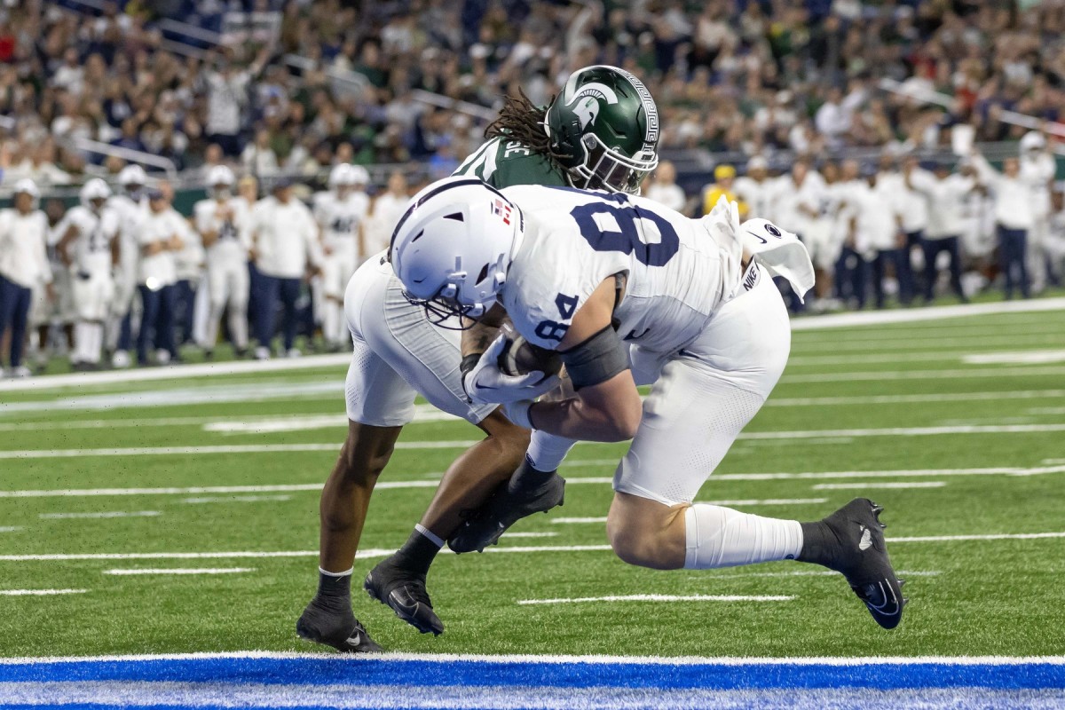 Nov 24, 2023; Detroit, Michigan, USA; Penn State Nittany Lions tight end Theo Johnson (84) scores a touchdown against the Michigan State Spartans during the second half at Ford Field. Mandatory Credit: David Reginek-USA TODAY Sports  